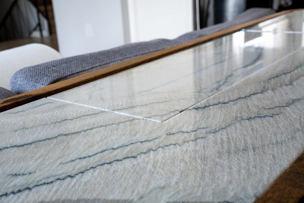 Detail on the solid wood x stone top Whisky Credenza