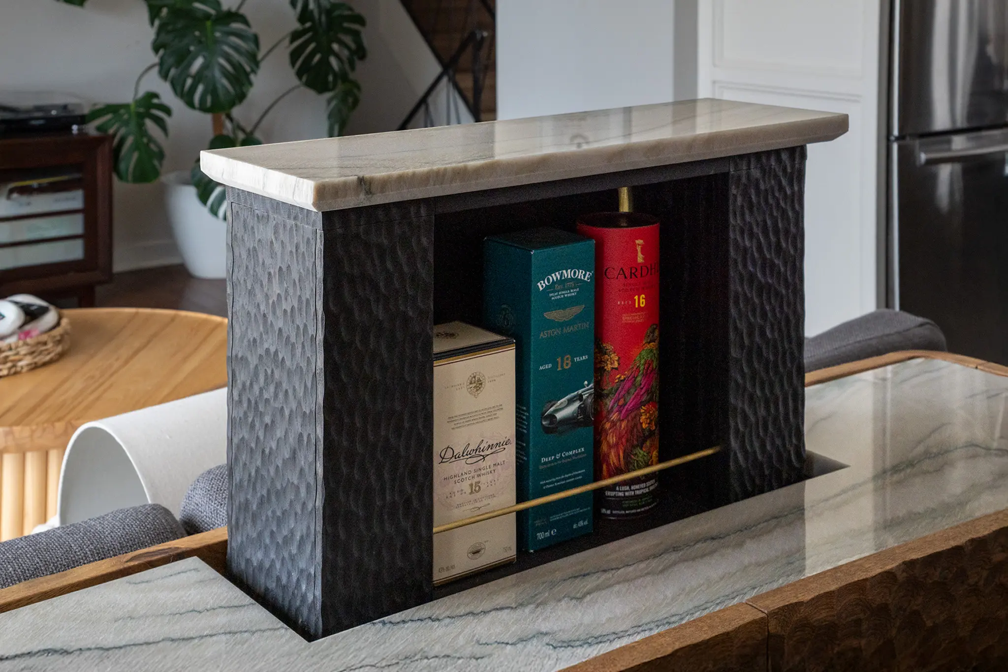 Detail on the top shelf of the whisky credenza