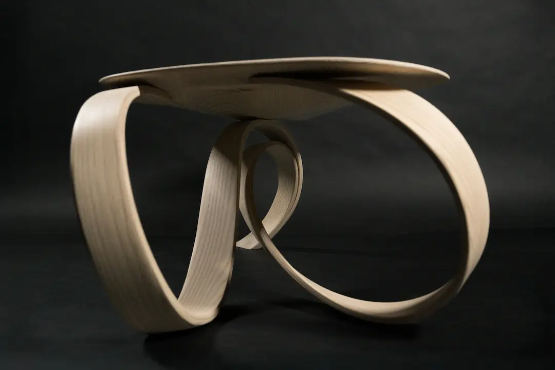 Side view on the base of the bent wood coffee table
