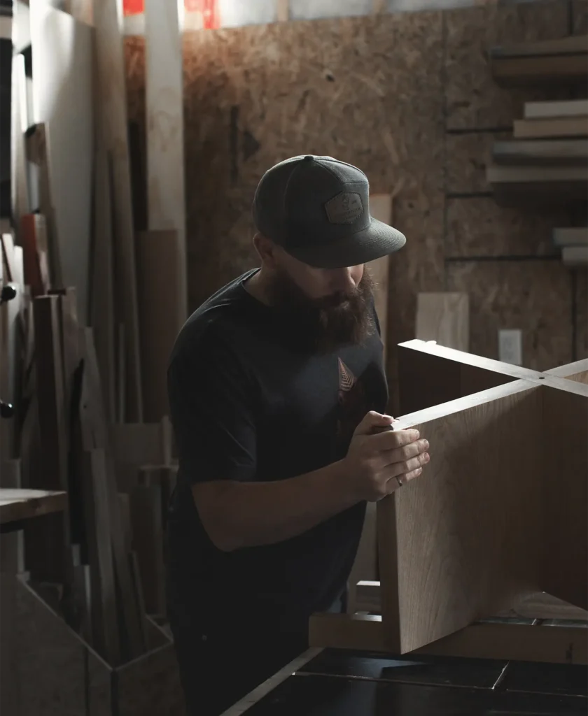 A Custom Furniture Craftsperson building a table
